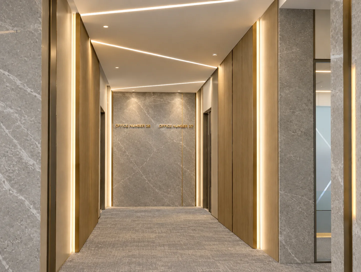 Warmly lit iTower office corridor with marble, timber and gold details